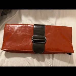 Beautiful leather clutch! Purchased at a boutique and used once. Vegan Leather!